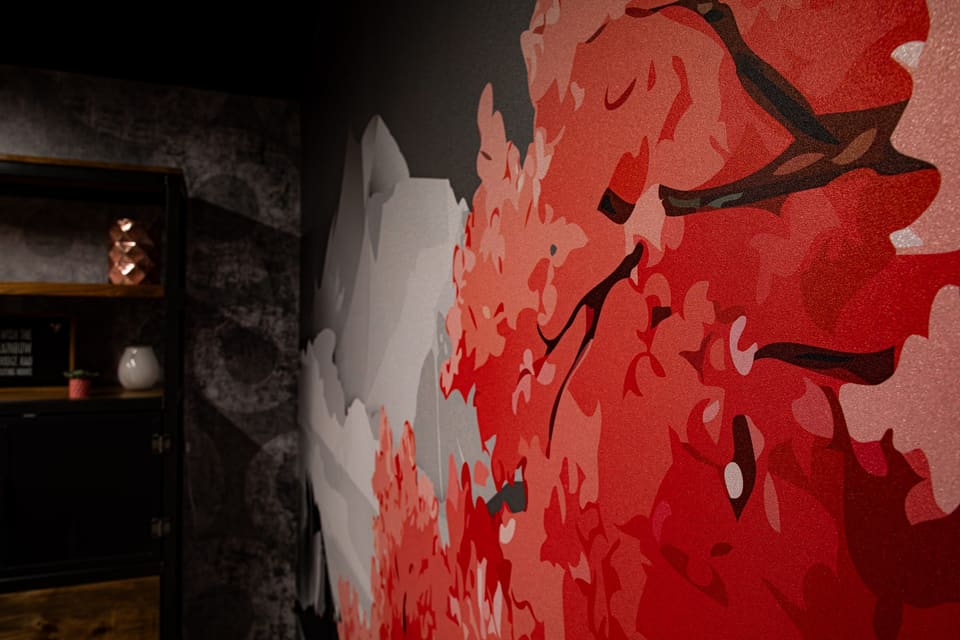 Close view of the red and gray mural texture on an office wall