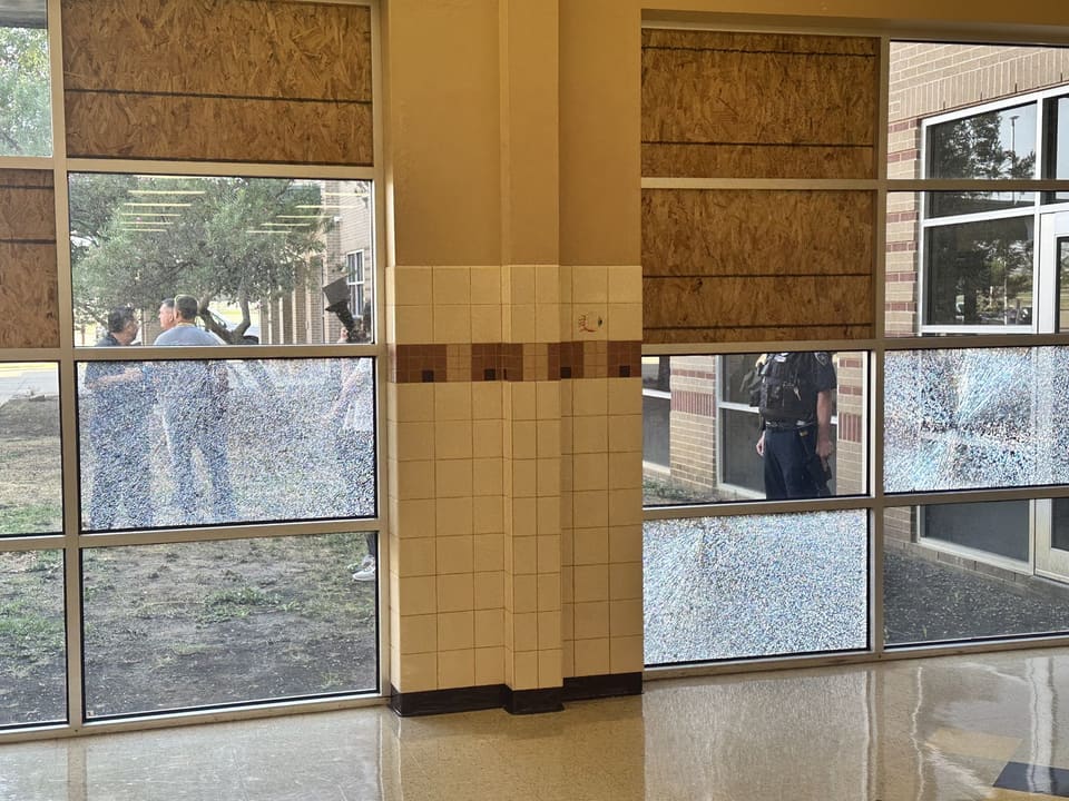 Godley ISD entry glass after the 2023 windstorm: the pane is shattered but held in the frame by 3M security film attached with the Epic Method