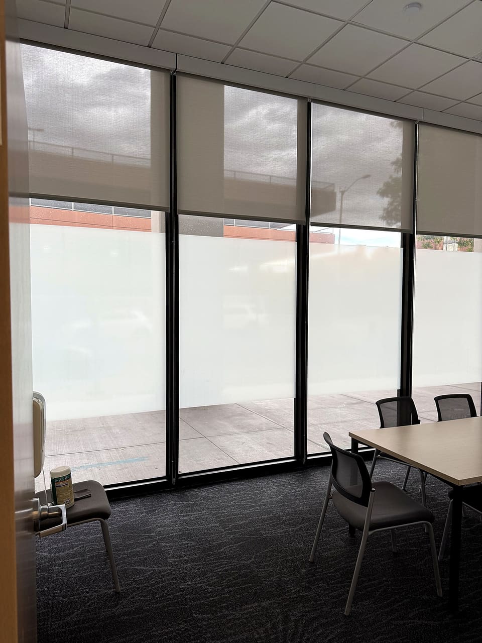 Conference room with a frost privacy band over security film on the perimeter glass