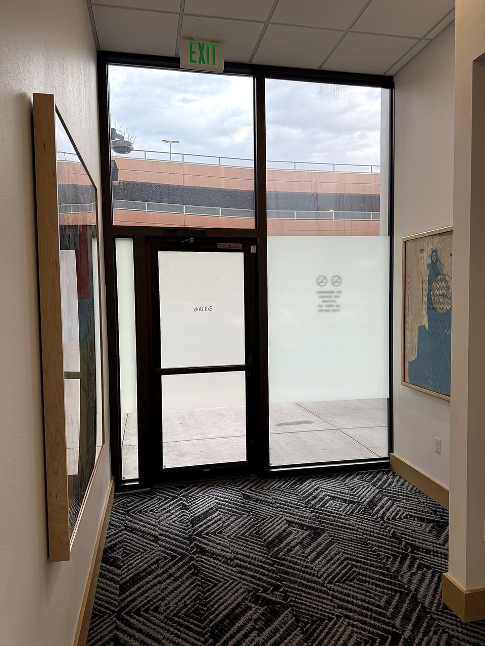 Entry glass at the Albuquerque county building with the printed frost band over the security film