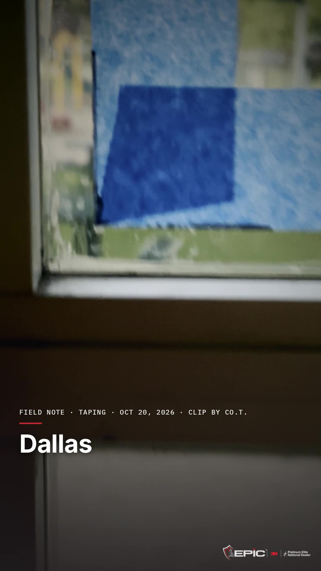 Blue tape being run along a window frame at a Dallas ISD school, the line the 3M Impact Protection Attachment bead will follow